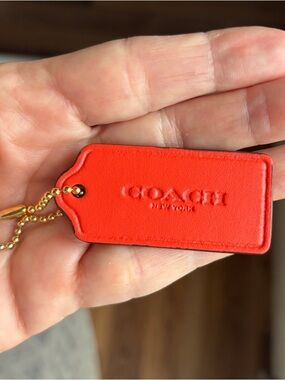 Coach Orange Smooth Leather hang Tag Keychain with Gold Chain